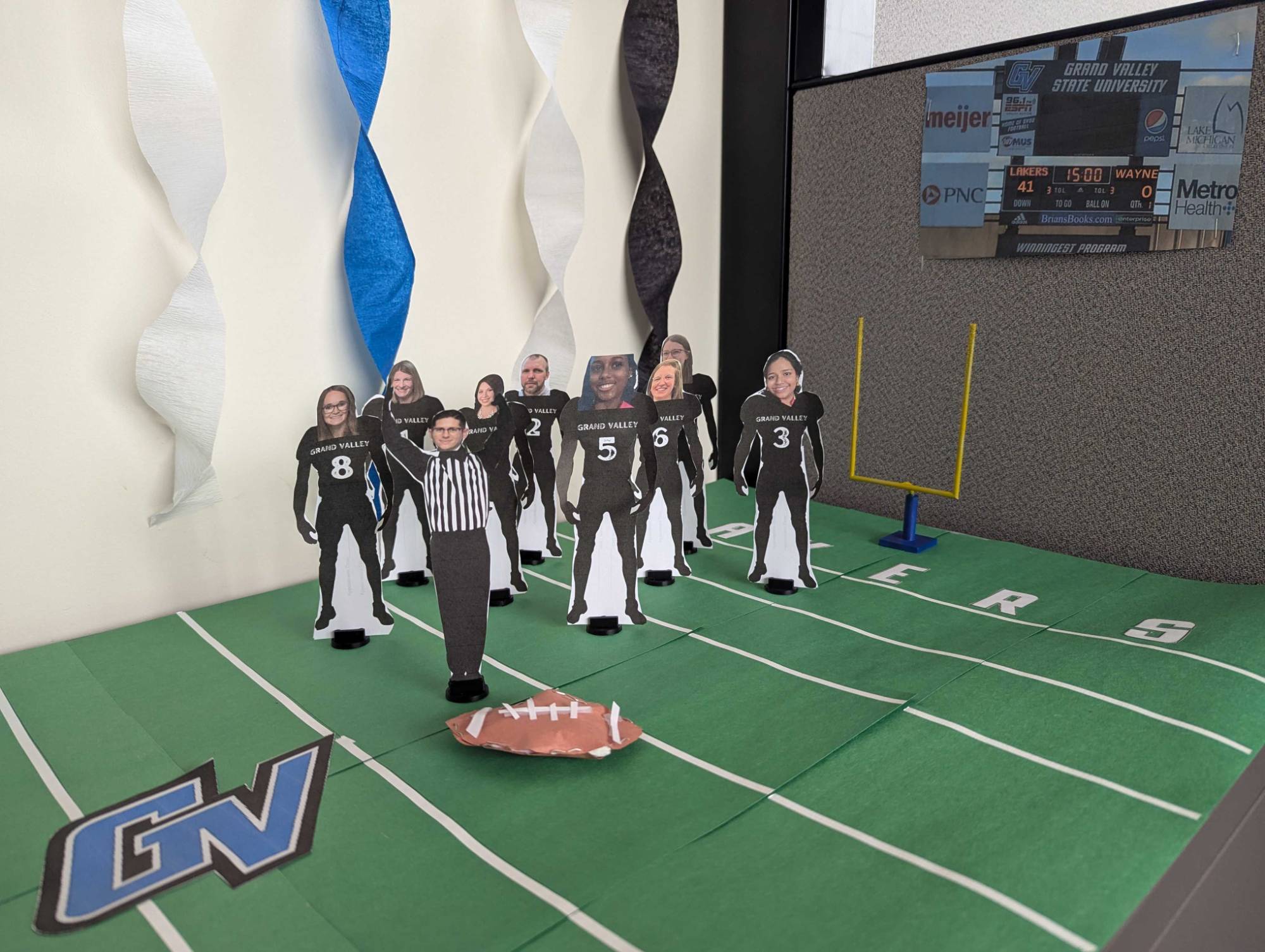 College of Computing Advising Center football player cutouts